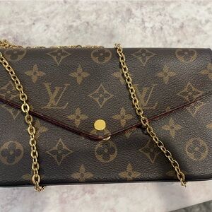 Louis Vuitton cross body bag .